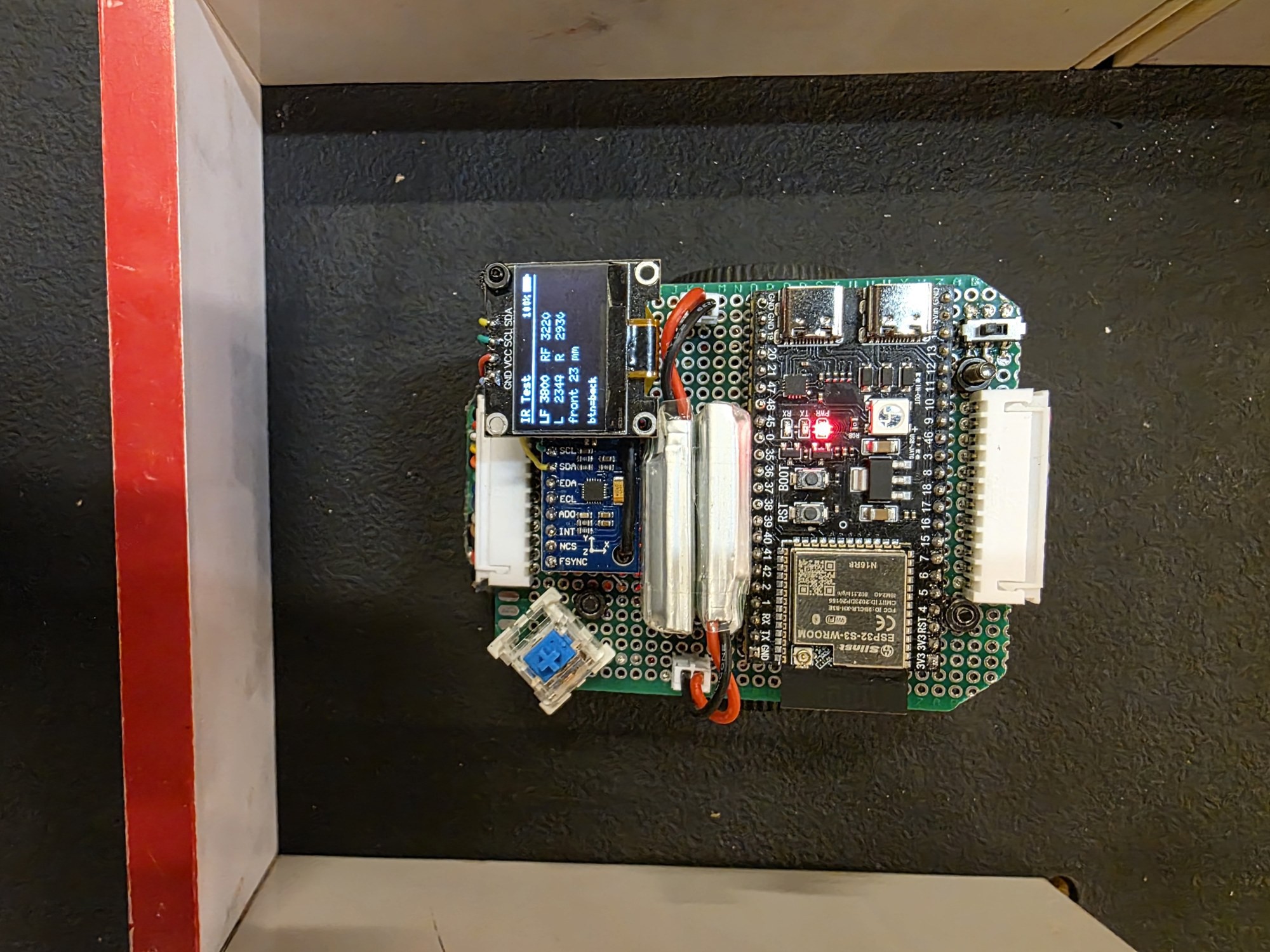NeuroMouse V2.0 from above in a maze cell.