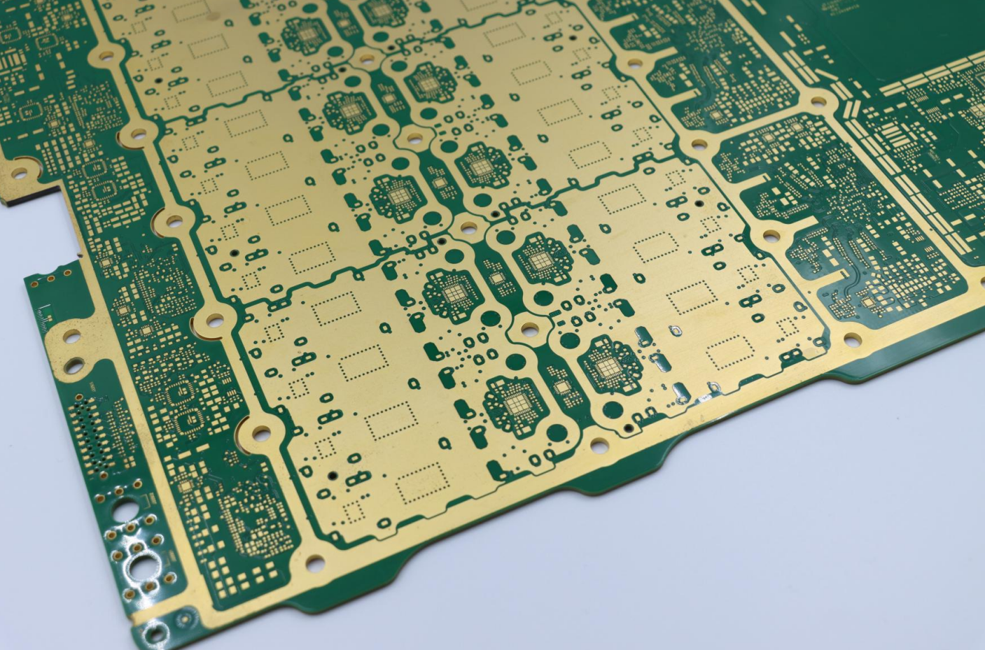 Close-up view of a PCB corner showing copper traces and electronic components for EV BMS PCB design