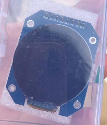 A round LCD display in a little plastic box.