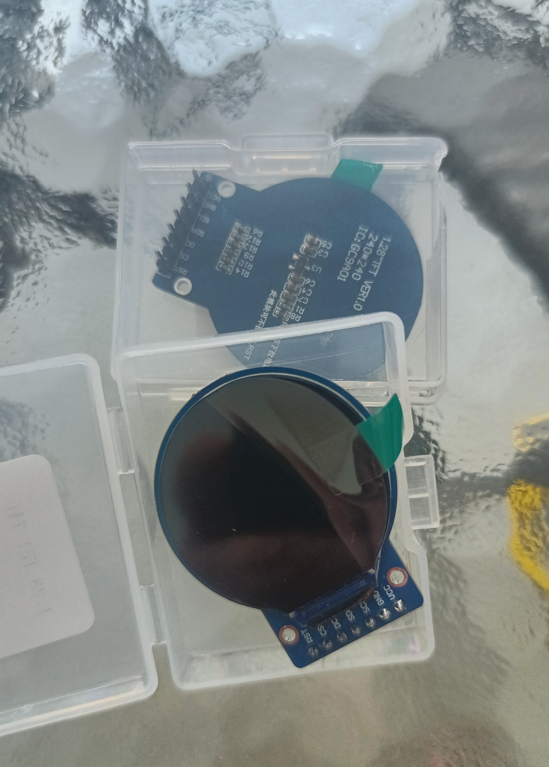 The newly arrived round display modules in their cases